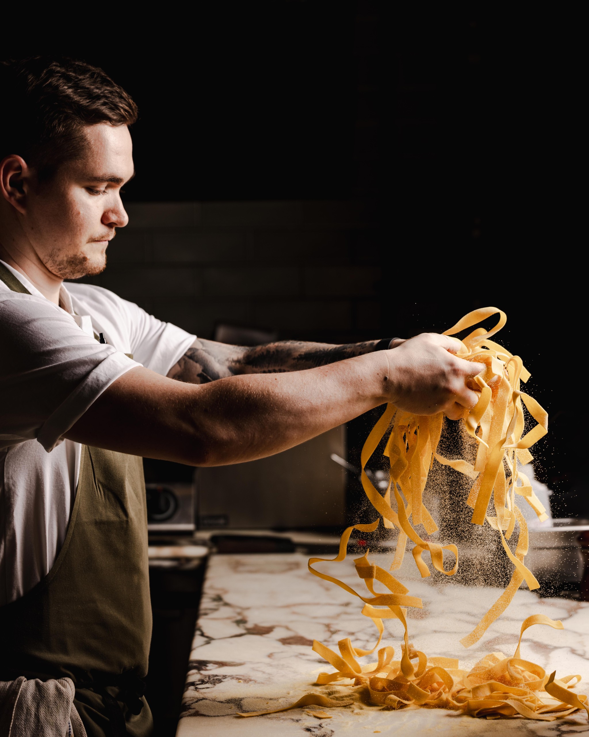 A chef preparing fresh pasta.
